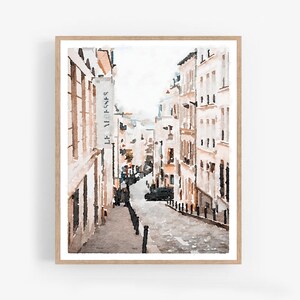 May include: A watercolor painting of a narrow street in Paris, France. The street is lined with buildings, and there are people walking on the sidewalk. The sign on the building reads "Le Versene".