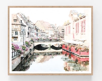May include: A watercolor painting of a European city with a bridge over a canal. The buildings are painted in soft pink and white tones, with green trees and flowers along the banks of the canal.