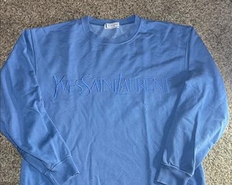 Sudadera azul vintage de Yves Saint Laurent con borde sin rematar