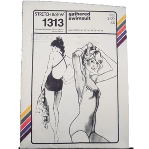 May include: A white sewing pattern envelope for a Stretch & Sew 1313 gathered swimsuit. The front features black and white illustrations of a swimsuit with a gathered neckline and crisscross back straps, with bust sizes 30-42 listed clearly.