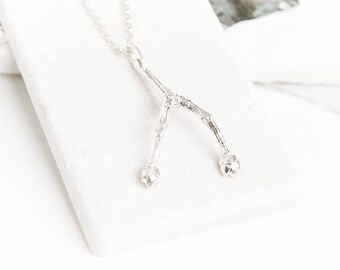 A sterling silver or gold vermeil twig wishbone necklace