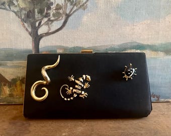Vintage MCM 1950s iconic Garay black silk clutch adorned with reptile snake lizard beetle brooches, one-of-a-kind archival custom piece