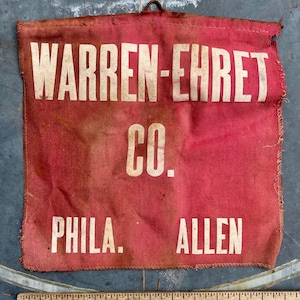 May include: A red fabric banner with white text that reads "WARREN-EHRET CO. PHILA. ALLEN".