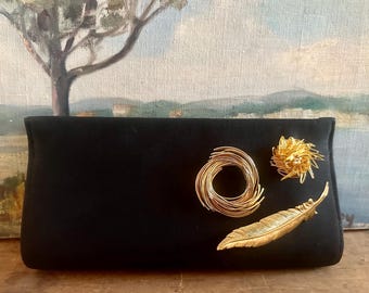 Vintage MCM 1950s black clutch adorned with  dimensional brooches, figural bird nests, feather, one-of-a-kind archival custom piece