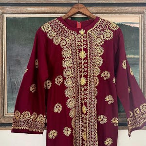 Vintage 1960s-70s maroon caftan with bold golden yellow embroidery