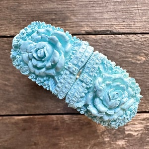 Vintage carved celluloid floral bracelet baby blue