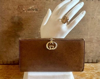 Genuine 1960s-70s vintage Gucci brown leather wallet 6.75” x 3.5” made in Italy triple-marked iconic brass double-G logo clasp