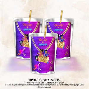 May include: Three purple and silver juice pouches with a gold chain and a design of a girl and boy with a boombox and makeup. The text on the pouches reads "Beauty or Beats".