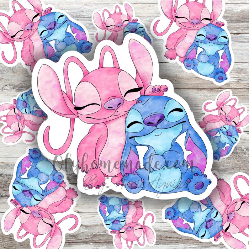 May include: Watercolour sticker featuring a pink and blue Stitch and Angel couple. The characters are hugging and have their eyes closed. The sticker is on a white background.