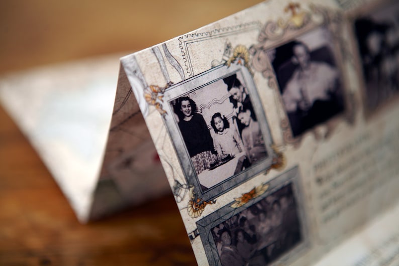 May include: A vintage scrapbook with multiple black and white photos of people. The photos are framed with decorative borders and have a faded look. The scrapbook is open to a page with a photo of three people, two girls and a man, standing together.