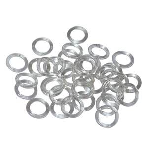 May include: A pile of clear rubber bands, also known as hair ties, in various sizes.
