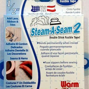 May include: A package of Steam-A-Seam 2 double stick fusible tape. The package is white and blue, with text in English and Spanish. The tape is 1/2 inch wide and 20 yards long.