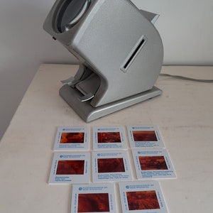 Vintage slide viewer with 8 slides of the Volkswagen factory in Wolfsburg