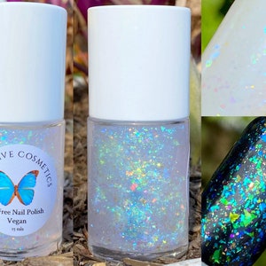 May include: A clear glass bottle of iridescent nail polish with a white cap. The bottle has a label that says "Addictive Cosmetics" and "10 Free Nail Polish Vegan 15 mls". The polish is a light blue color with iridescent glitter.