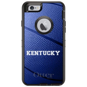 May include: A blue and black OtterBox phone case with a basketball pattern and the word "KENTUCKY" in white text.