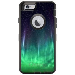 May include: Black OtterBox Defender Series case for iPhone 6 Plus with a green and blue aurora borealis design. The case has a built-in screen protector and port covers.