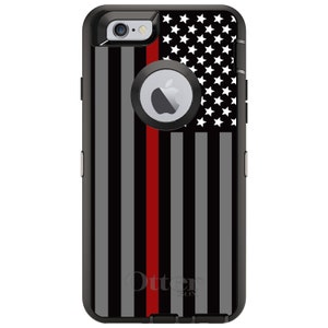 May include: Black OtterBox phone case with a red line down the center and an American flag design. The case has a cutout for the camera and the Apple logo.