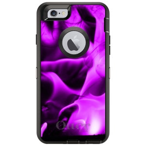 May include: A black OtterBox phone case with a vibrant purple flame design. The case features a black frame, a camera cutout, and the Apple logo. The OtterBox logo is visible at the bottom.