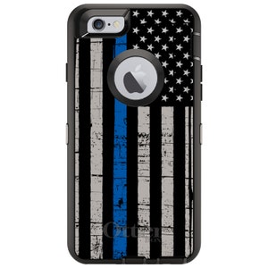 May include: Black phone case with a distressed American flag design and a thin blue line down the center. The case is made by OtterBox.