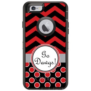 May include: Black and red iPhone case with a chevron pattern and a white circle with the text "Go Dawgs!" in black. The case also has a black and white polka dot pattern.