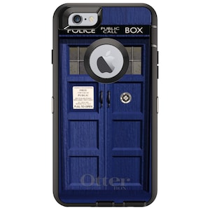 May include: A blue and black phone case with a TARDIS design. The case has a black OtterBox logo and the text "PUBLIC CALL BOX" on the front.