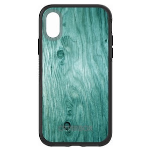May include: A teal blue OtterBox phone case with a wood grain pattern. The case has a black border and a cutout for the camera lens.
