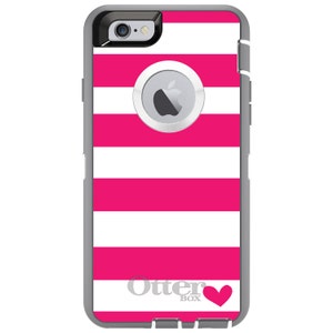 May include: A pink and white striped iPhone case with a gray OtterBox logo and a small pink heart. The case is designed for an iPhone 6 or 6s.