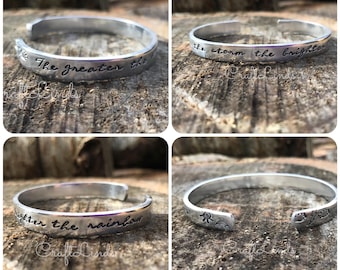 Hand stamped cuff, the greater the storm the brighter the rainbow, sun, lightning, bracelet, bangle, inspirational, strength, overcome,