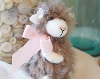 Fuzzy sheep with pink bow