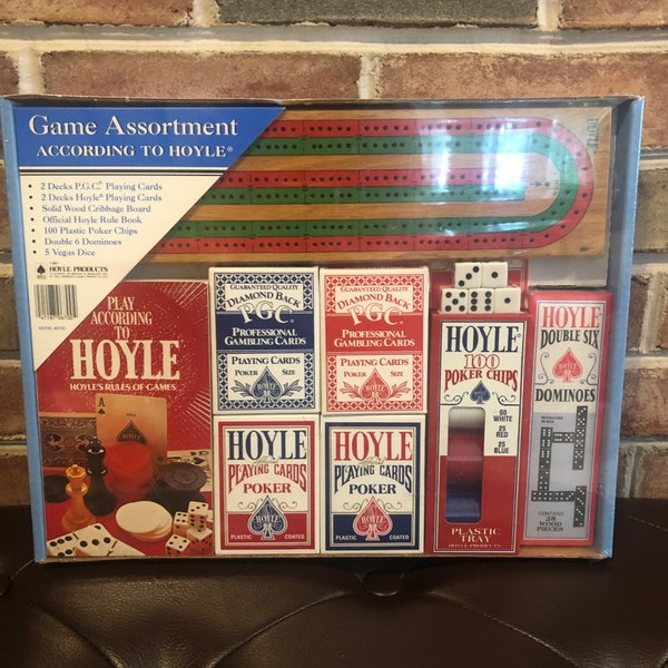 According to Hoyle Game Assortment 1991 New PGC Cards Rule Book Vegas Dice Poker Chips Cribbage Board