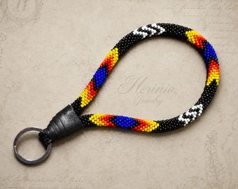 Black Native Style Beaded Wristlet with Red, Yellow, White and Royal Blue Accents