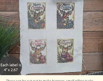 May include: A rectangular piece of light beige fabric featuring four printed rectangular labels, each displaying a deer with antlers, pine branches, and the text Merry Christmas. Each label measures 4 inches by 2.67 inches.