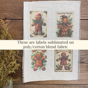May include: Four rectangular labels featuring gingerbread men with festive decorations. The labels are printed on a poly/cotton blend fabric. The text "Gingerbread Blessings" is visible on one label. The labels are arranged on a neutral-colored background.