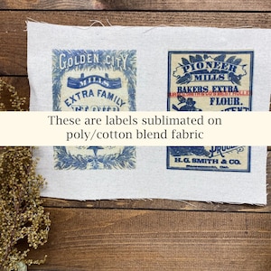 May include: Four vintage-style labels printed in blue ink on a light-colored fabric. The labels feature text such as "GOLDEN CITY MILLS" and "PIONEER MILLS BAKERS EXTRA FLOUR." The text "These are labels sublimated on poly/cotton blend fabric" is also present.