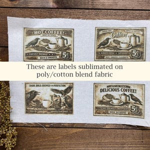 May include: Four vintage-style coffee labels printed on fabric. Each label features coffee-related imagery, including a raven, coffee beans, a cup, and a teapot. The labels have text that reads "Hot Coffee!", "Delicious Coffee!", and "Coffee!"