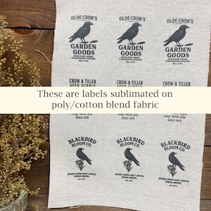 May include: Labels printed on poly/cotton blend fabric. The labels feature crow illustrations and text such as "Garden Goods" and "Blackbird Bloom Co." The text "These are labels sublimated on poly/cotton blend fabric" is also visible.