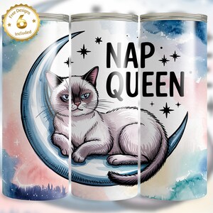 May include: A white tumbler with a watercolor design featuring a grumpy cat on a crescent moon, the words "NAP QUEEN", and star accents. Includes a gold sticker that says "Free Designs 6 Included".