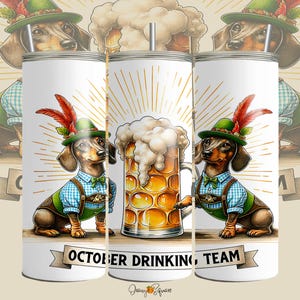 May include: A white tumbler with a cartoon illustration of two dachshunds in Bavarian outfits, either side of a beer stein. The tumbler has the text "OCTOBER DRINKING TEAM" on a banner.