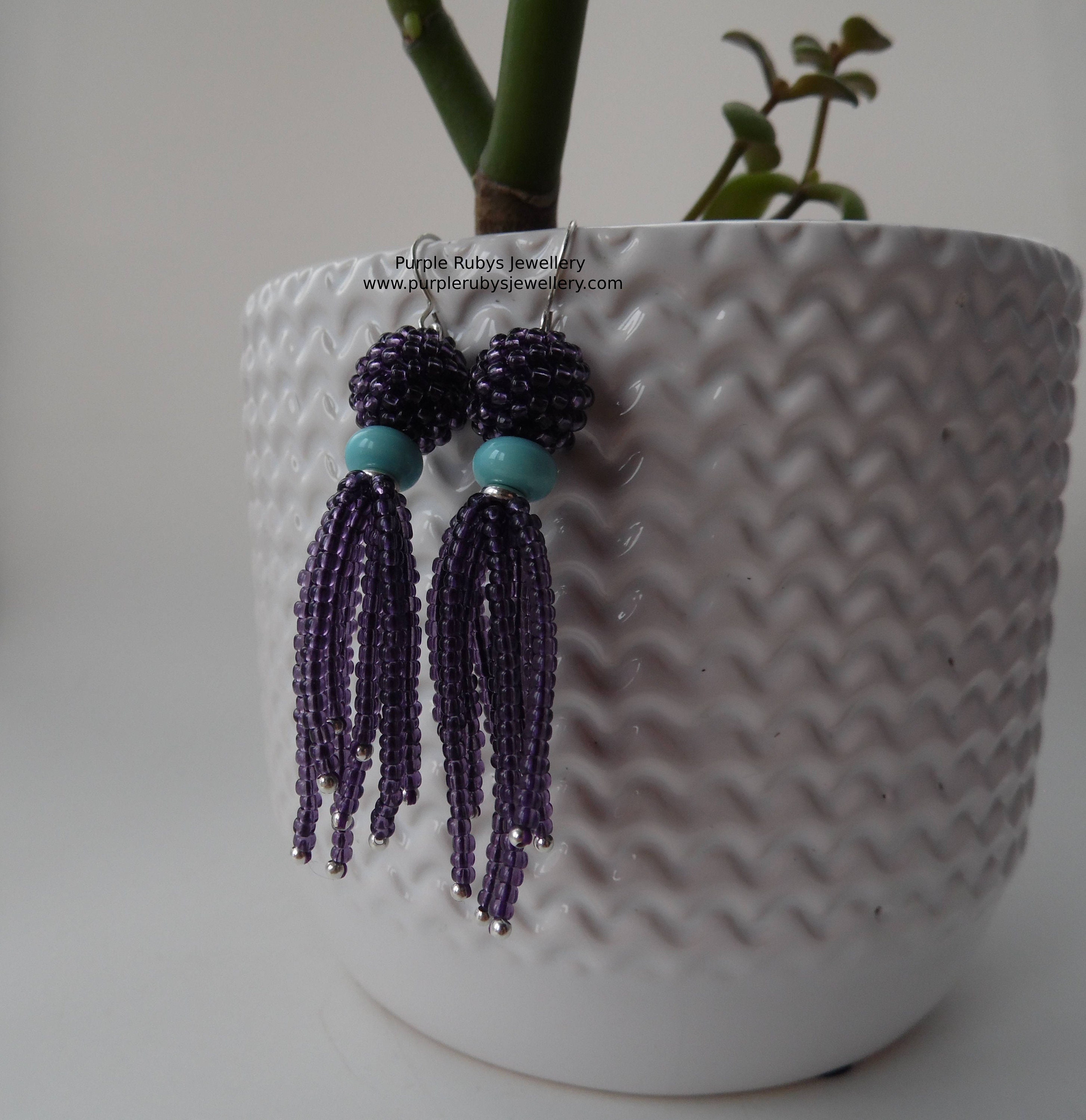 Buy purple tassel earrings at Amazon.in