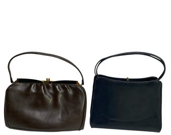 90 年代の本物のブラック MCM ハンドバッグ（エンボスロゴ付き）|高級