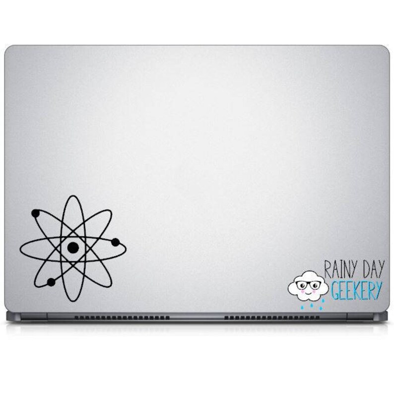 May include: A silver laptop with a black atom symbol and a cartoon cloud with glasses and the text "Rainy Day Geekery".