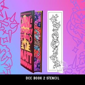 May include: A hardcover book titled Carl's Doomsday Scenario by Matt Dinniman with a colorful illustrated spine and a matching rectangular white stencil featuring black line art of spiky spheres and dragon-like creatures.