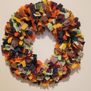 17 inch fall fabric rag wreath. Mix of fall colors.
