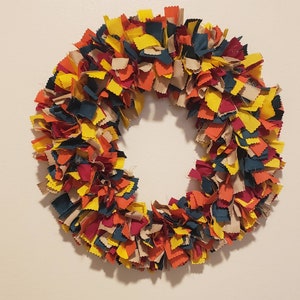 17 inch fall fabric rag wreath. Mix of fall colors.