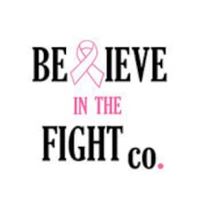 May include: Black and white graphic with the text "BELIEVE IN THE FIGHT co." The word "BELIEVE" is in a bold, sans-serif font, with a pink ribbon graphic replacing the "L". The words "IN THE" are in pink, and "FIGHT co." is in a bold, sans-serif font.