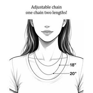 May include: A black and white line drawing of a necklace chain with the text Adjustable chain one chain two lengths! The illustration shows the chain at two different positions labelled with arrows pointing to 18 inches and 20 inches respectively.