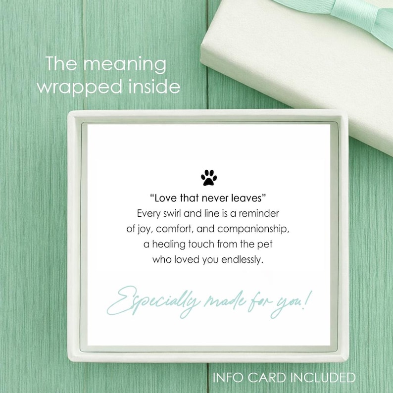 May include: A square white card with a black paw print icon and the text: Love that never leaves. Every swirl and line is a reminder of joy, comfort, and companionship, a healing touch from the pet who loved you endlessly. Especially made for you!