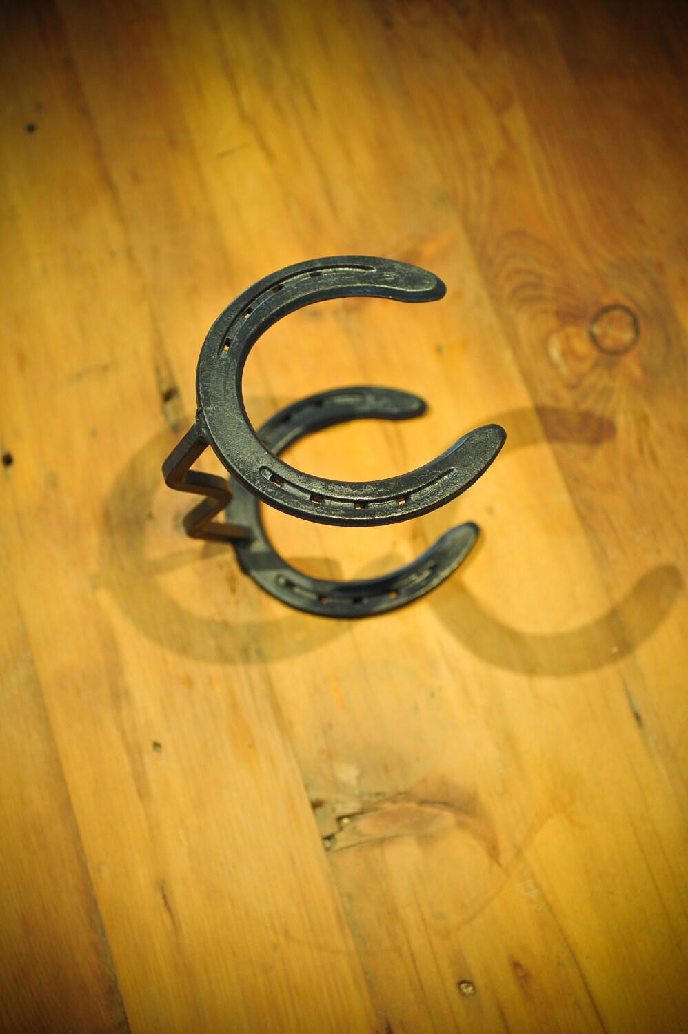 Horseshoe Cowboy Hat Stand. Hand formed 3/8 sq. stock 6 1/2L x 4 5/8W x 8H.