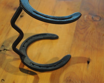 Horseshoe Cowboy Hat Stand. Hand formed 3/8 sq. stock 6 1/2"L x 4 5/8"W  x 8"H.