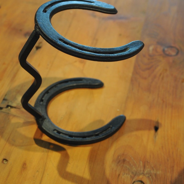 Horseshoe Cowboy Hat Stand. Hand formed 3/8 sq. stock 6 1/2"L x 4 5/8"W  x 8"H.